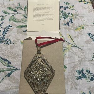 Hallmark keepsake silver loinsettia ornament.